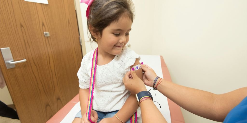 girl getting vaccine