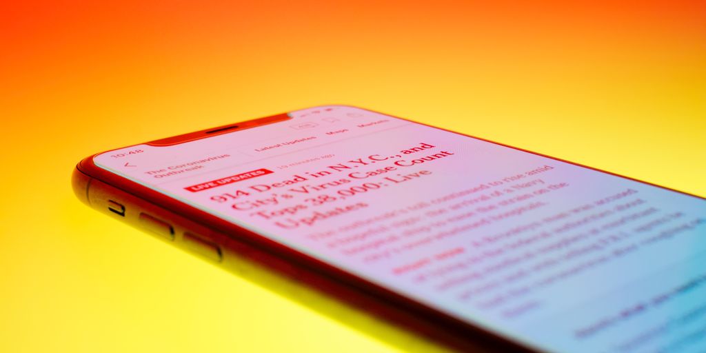 black android smartphone on orange surface